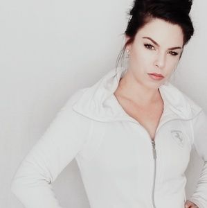 White puma athletic jacket with Ferrari symbol